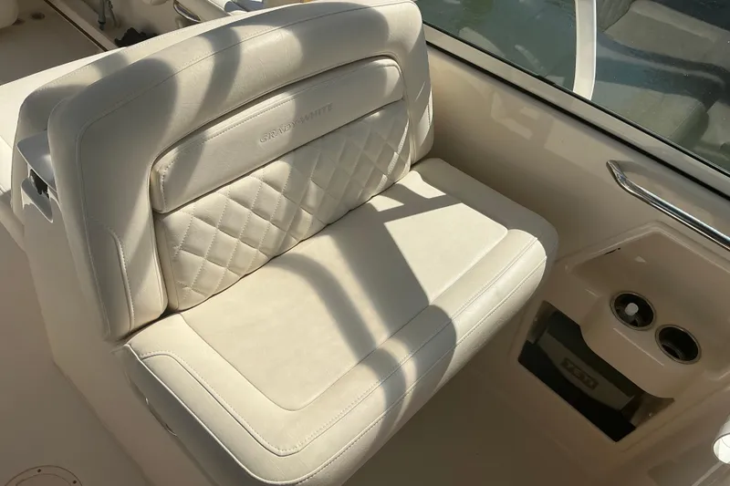 Slide: The Image of 2020 Grady-White Freedom 285 boat seat with quilted design and cup holders. - 25