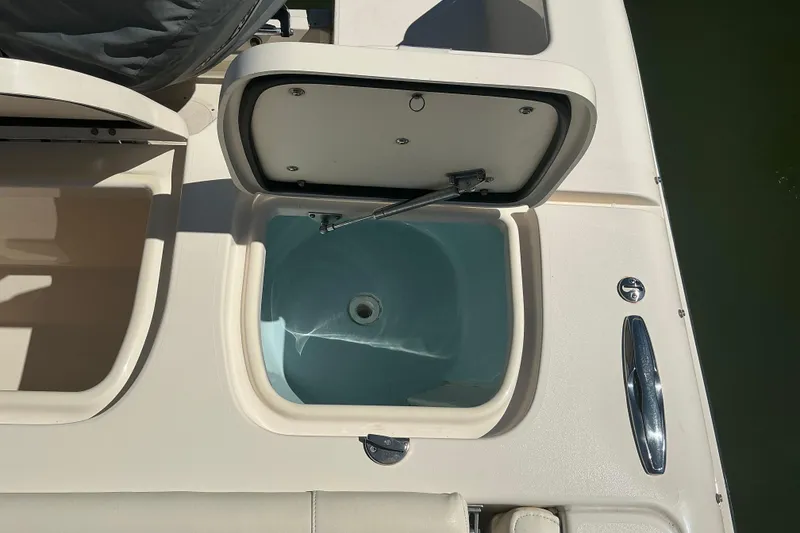 Slide: The Image of Open storage compartment on 2020 Grady-White Freedom 285 boat deck. - 27