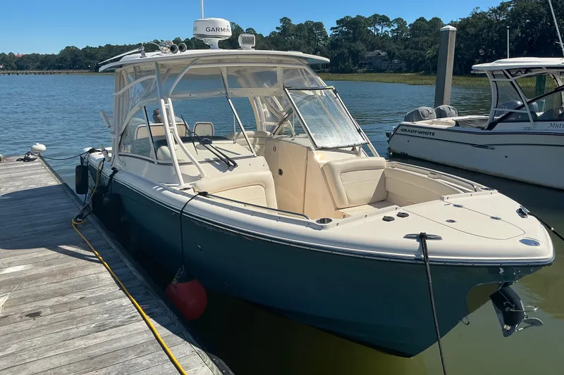Slide: The Image of 2020 Grady-White Freedom 285 boat docked on a sunny day. - 3