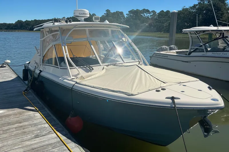 Slide: The Image of 2020 Grady-White Freedom 285 boat docked on a sunny day. - 5