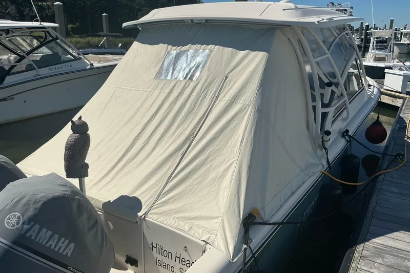 Slide: The Image of 2020 Grady-White Freedom 285 boat docked with protective cover, Hilton Head Island. - 6