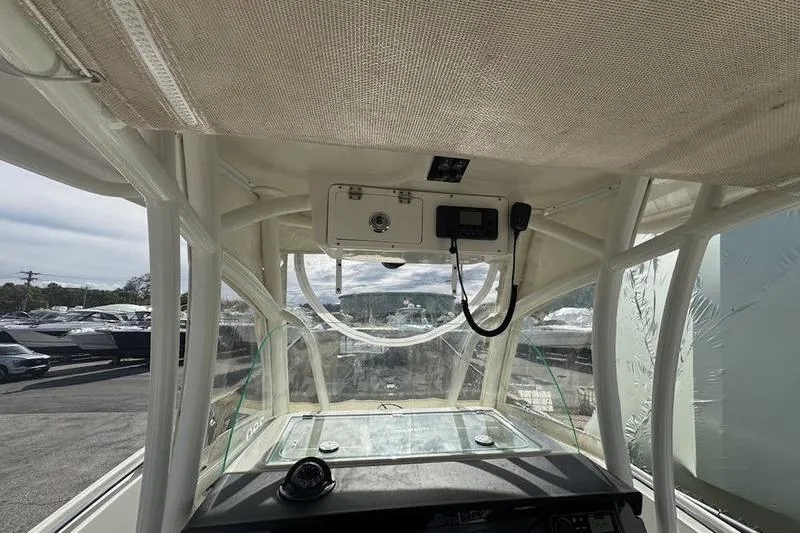 Slide: The Image of Interior view of 2021 Sailfish 290 CC boat cockpit with navigation equipment. - 12
