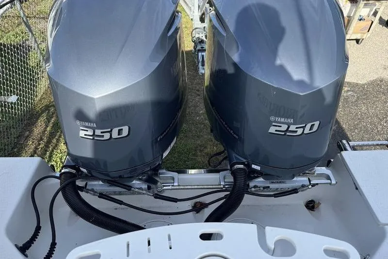 Slide: The Image of Twin Yamaha 250 engines on a 2021 Sailfish 290 CC boat. - 15