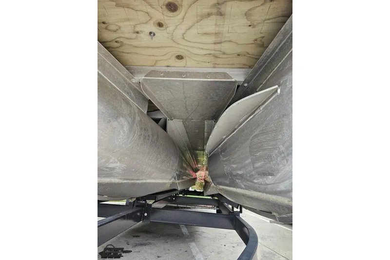 Slide: The Image of Underneath view of a 2015 Bennington 2550 QBR pontoon boat on a trailer. - 101