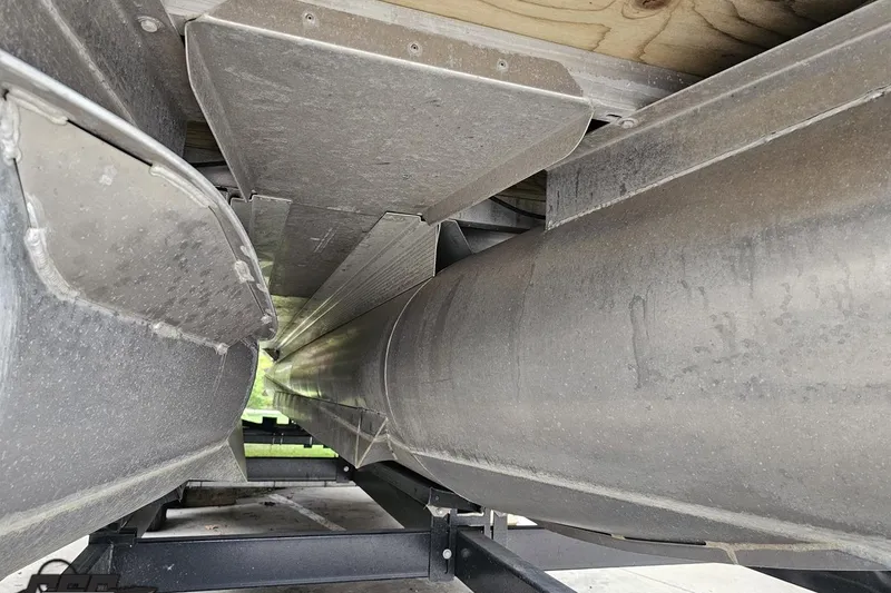 Slide: The Image of Underneath view of a 2015 Bennington 2550 QBR pontoon boat, showcasing its structure. - 102