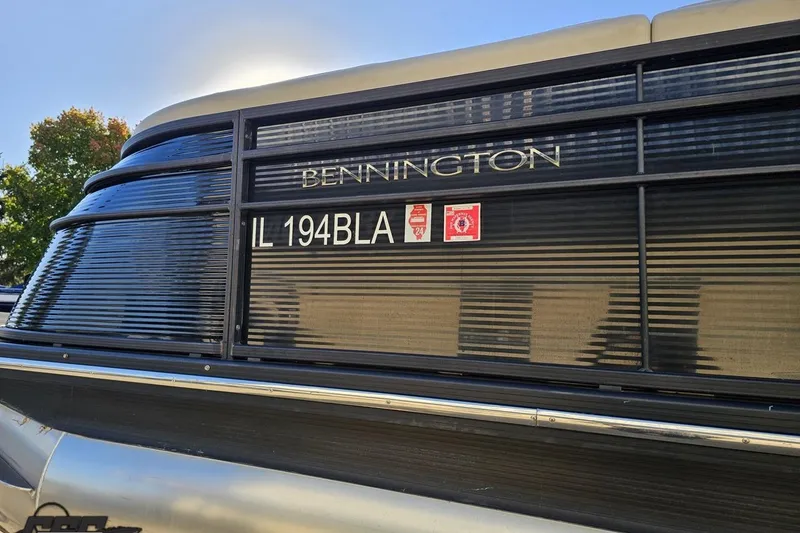 Slide: The Image of 2015 Bennington 2550 QBR boat with registration IL 194BLA, side view. - 24