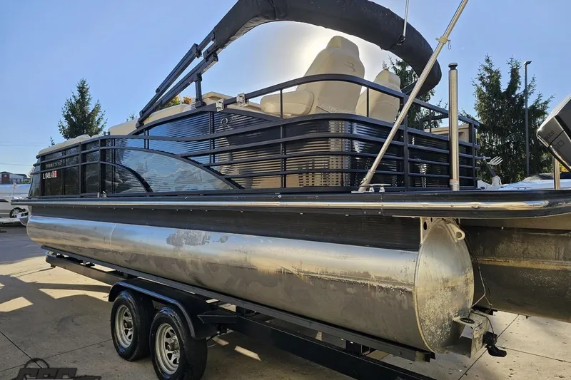 Slide: The Image of 2015 Bennington 2550 QBR pontoon boat on trailer, side view, sunny day. - 30