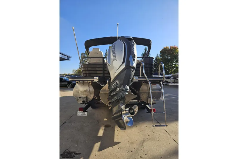 Slide: The Image of 2015 Bennington 2550 QBR pontoon boat with Evinrude outboard motor and ladder. - 33