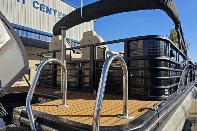 Slide: The Image of 2015 Bennington 2550 QBR pontoon boat with sleek design and modern features. - 35