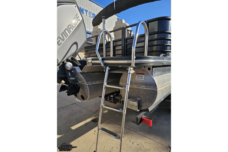 Slide: The Image of 2015 Bennington 2550 QBR pontoon boat with Evinrude engine and boarding ladder. - 36