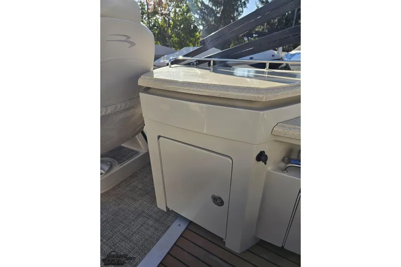 Slide: The Image of 2015 Bennington 2550 QBR boat interior with seating and storage compartment. - 45