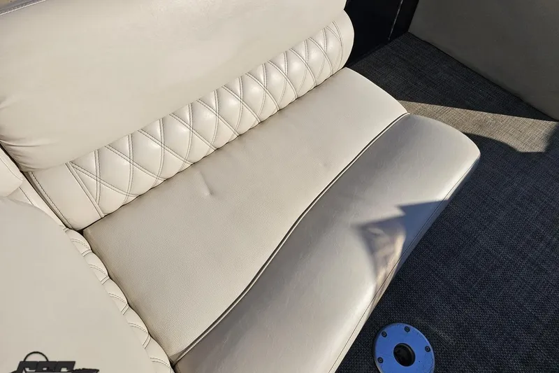 Slide: The Image of Luxurious seating on 2015 Bennington 2550 QBR boat, featuring diamond-stitched upholstery. - 49