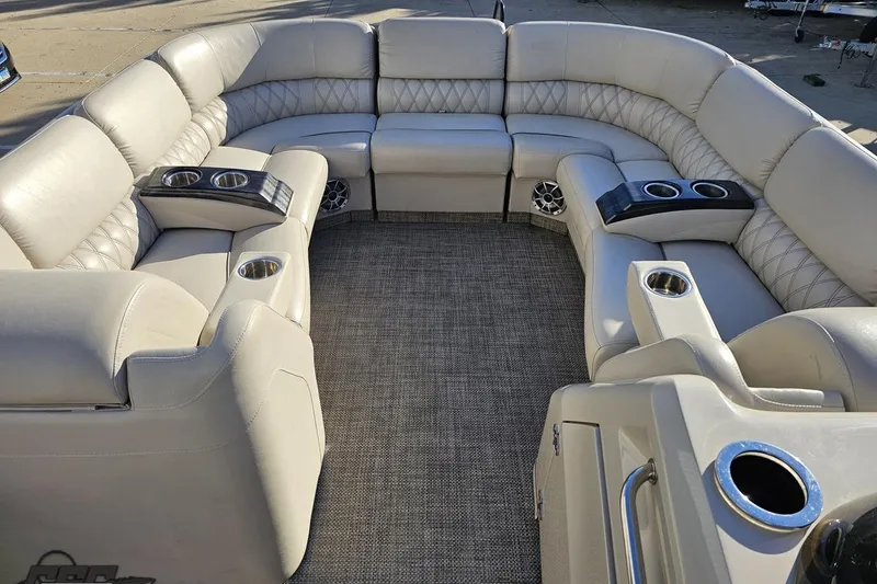 Slide: The Image of Luxurious seating on 2015 Bennington 2550 QBR pontoon boat with cup holders and speakers. - 55