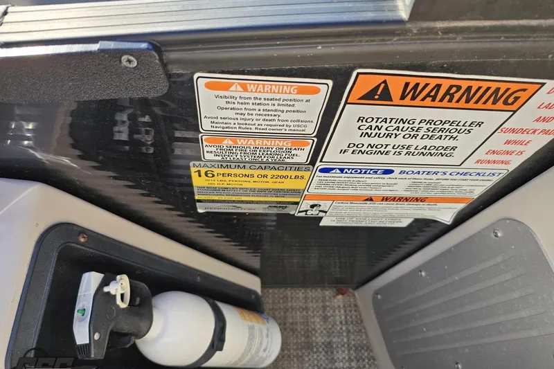 Slide: The Image of Warning labels and fire extinguisher on 2015 Bennington 2550 QBR boat. - 61