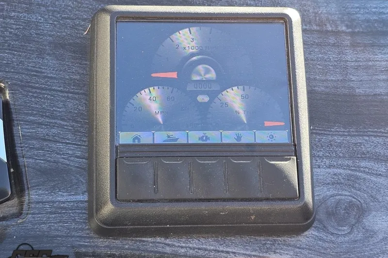 Slide: The Image of Dashboard of a 2015 Bennington 2550 QBR boat with digital gauges and controls. - 62