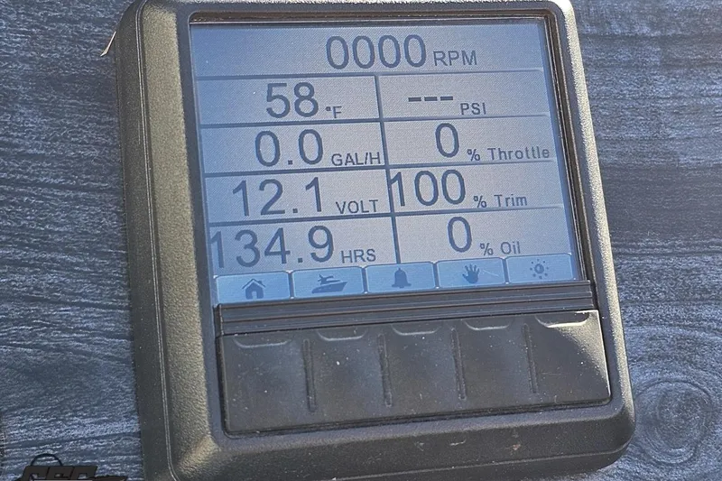 Slide: The Image of Dashboard display of a 2015 Bennington 2550 QBR showing RPM, temperature, and voltage. - 63