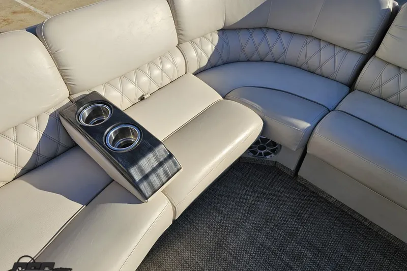 Slide: The Image of Luxurious seating on 2015 Bennington 2550 QBR boat with cup holders and elegant upholstery. - 75