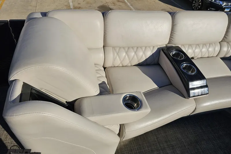 Slide: The Image of Luxurious seating with cup holders on 2015 Bennington 2550 QBR boat. - 76