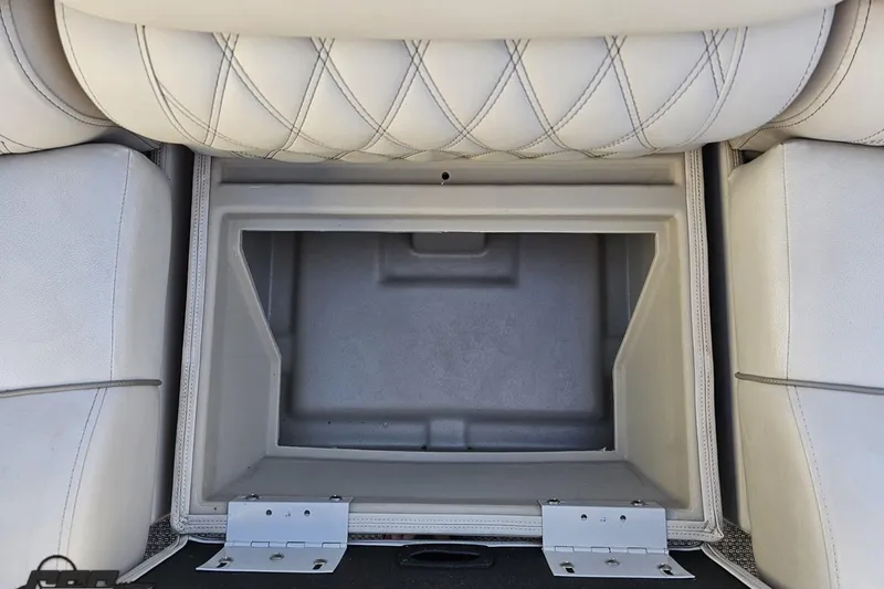 Slide: The Image of 2015 Bennington 2550 QBR boat storage compartment with cushioned seating. - 80