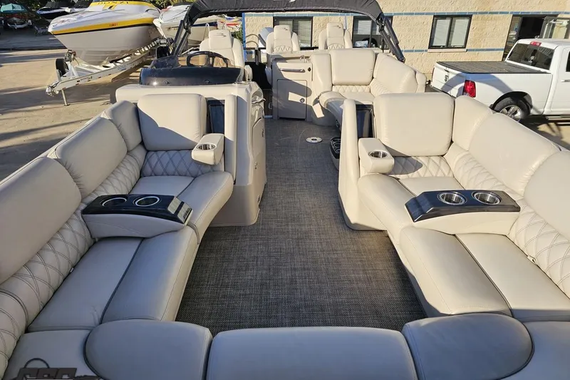 Slide: The Image of Luxurious interior of 2015 Bennington 2550 QBR pontoon boat with plush seating and cup holders. - 82