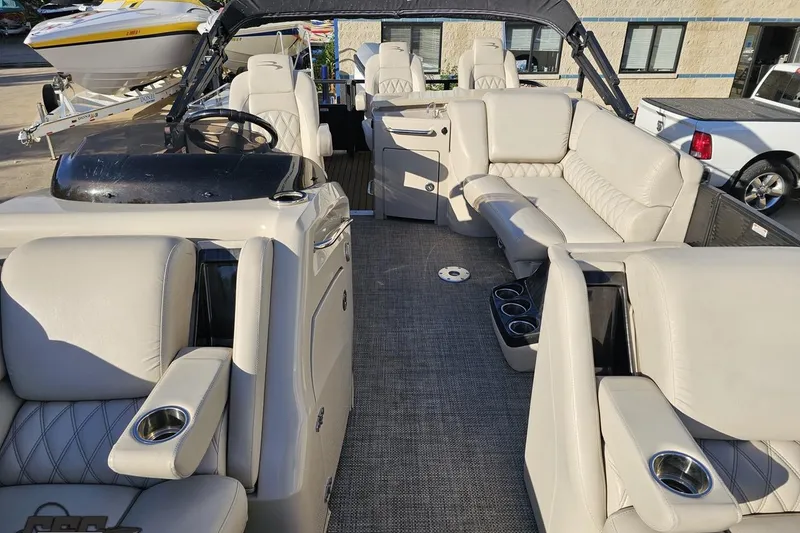 Slide: The Image of 2015 Bennington 2550 QBR pontoon boat interior with luxurious seating and modern design. - 83
