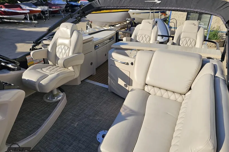 Slide: The Image of Luxurious interior of a 2015 Bennington 2550 QBR boat with plush seating. - 85