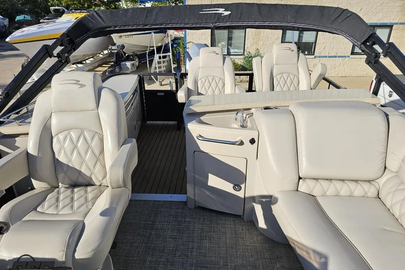 Slide: The Image of 2015 Bennington 2550 QBR boat interior with luxurious seating and modern design. - 87