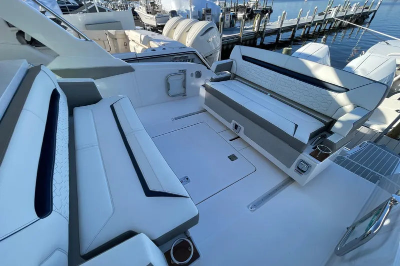 Slide: The Image of 2023 Tiara Yachts 34 LS boat interior with luxurious seating and modern design. - 32