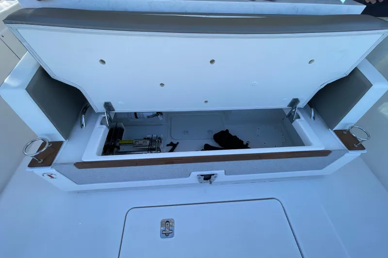 Slide: The Image of Open storage compartment on 2023 Tiara Yachts 34 LS boat, showcasing interior space. - 42