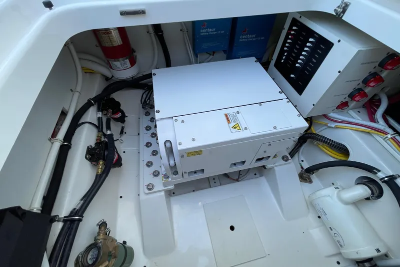 Slide: The Image of 2023 Tiara Yachts 34 LS engine compartment with electrical components and wiring. - 44
