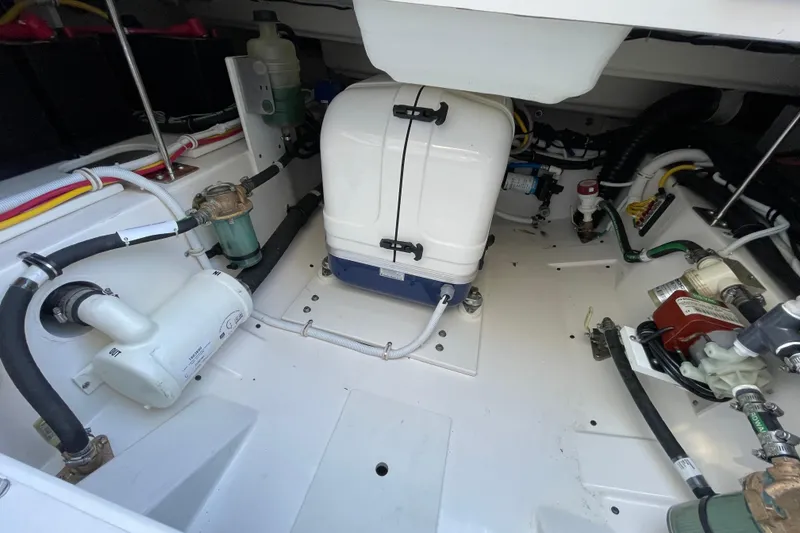 Slide: The Image of Engine compartment of 2023 Tiara Yachts 34 LS, showcasing mechanical components and systems. - 45