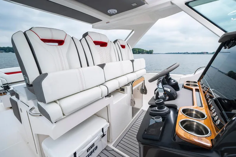 Slide: The Image of 2023 Tiara Yachts 34 LS docked at marina, featuring sleek design and modern amenities. - 7