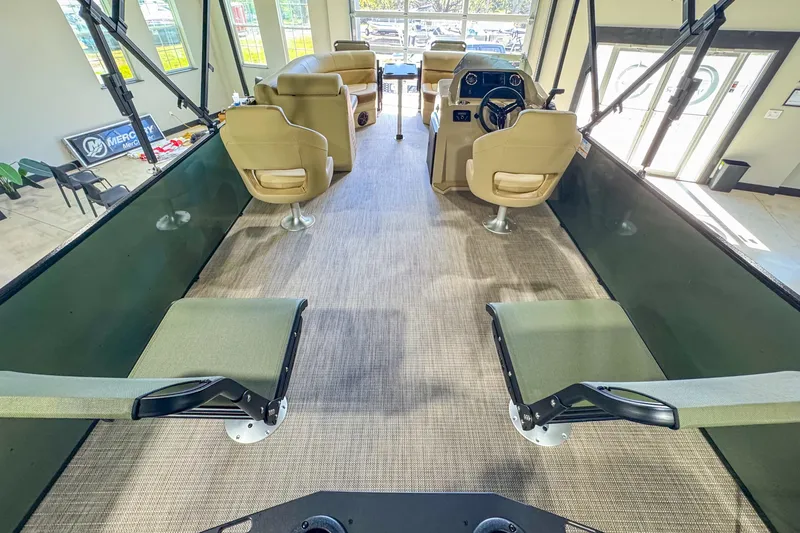 Slide: The Image of Interior of 2026 Veranda Vista 22F2/2/1 pontoon boat with beige seating and helm. - 12