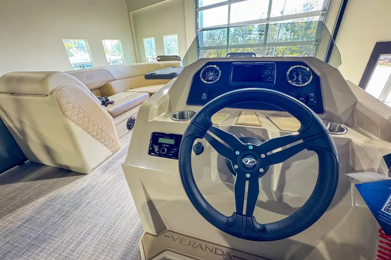 Slide: The Image of Interior of 2026 Veranda Vista 22F2/2/1 boat with steering wheel and seating. - 16