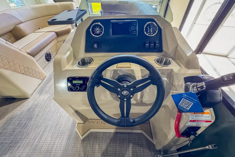 Slide: The Image of 2026 Veranda Vista 22F2/2/1 boat interior with steering wheel and dashboard controls. - 17