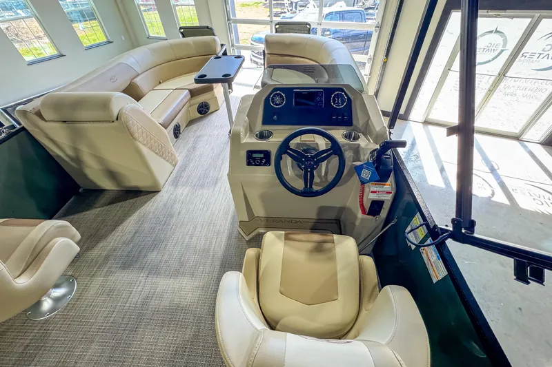 Slide: The Image of Luxurious interior of 2026 Veranda Vista 22F2/2/1 pontoon boat with plush seating and modern helm. - 21