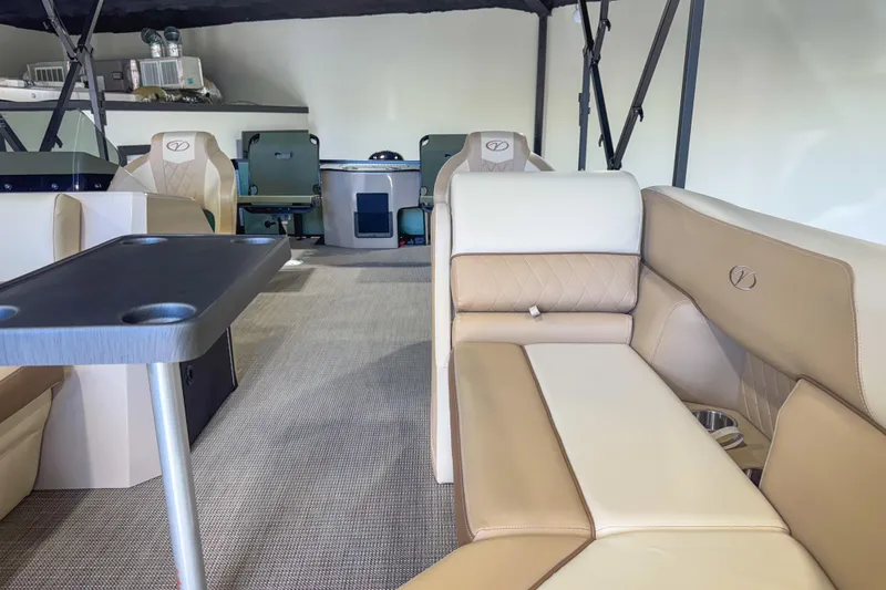 Slide: The Image of Luxurious interior of 2026 Veranda Vista 22F2/2/1 pontoon boat with plush seating and table. - 27