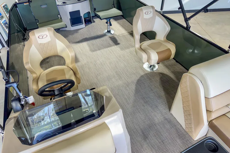 Slide: The Image of 2026 Veranda Vista 22F2/2/1 pontoon boat interior with beige seating and steering console. - 28