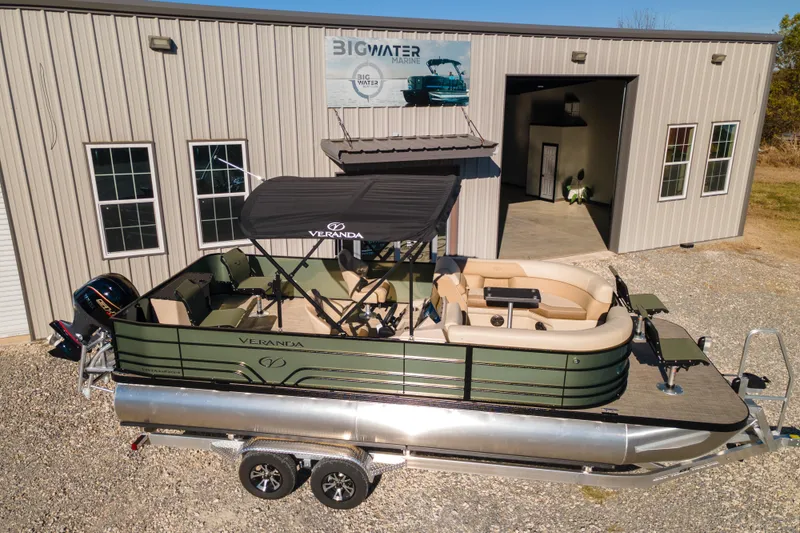 Slide: The Image of 2026 Veranda Vista 22F2/2/1 pontoon boat parked outside Big Water Marine. - 6