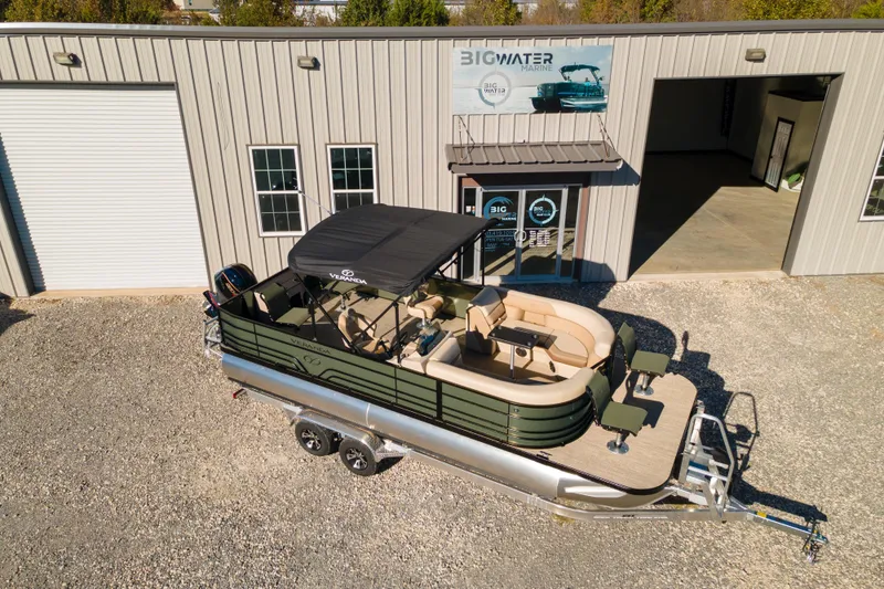 Slide: The Image of 2026 Veranda Vista 22F2/2/1 pontoon boat parked outside Big Water Marine dealership. - 7