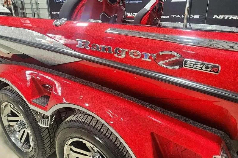 Slide: The Image of 2025 Ranger Z520R Cup-Equipped boat, red with chrome accents, close-up view. - 12