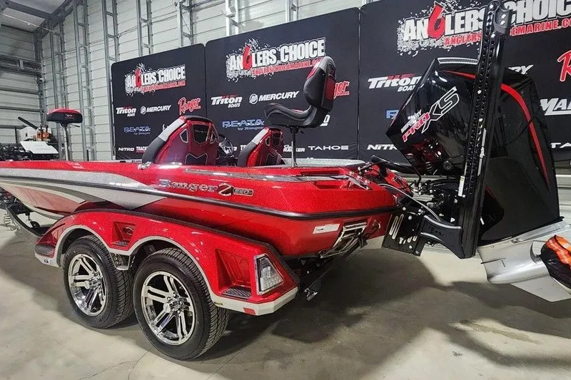 Slide: The Image of 2025 Ranger Z520R Cup-Equipped boat in showroom, featuring sleek red design and powerful engine. - 3
