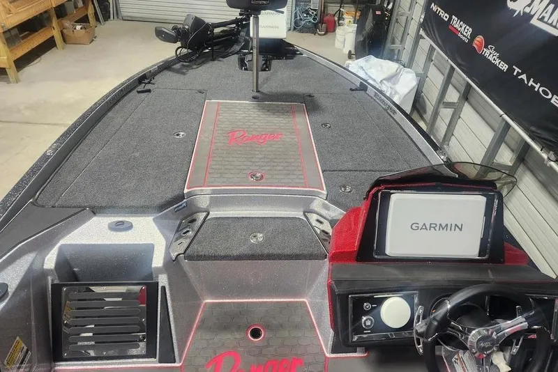 Slide: The Image of 2025 Ranger Z520R Cup-Equipped boat with Garmin navigation system in a garage setting. - 7
