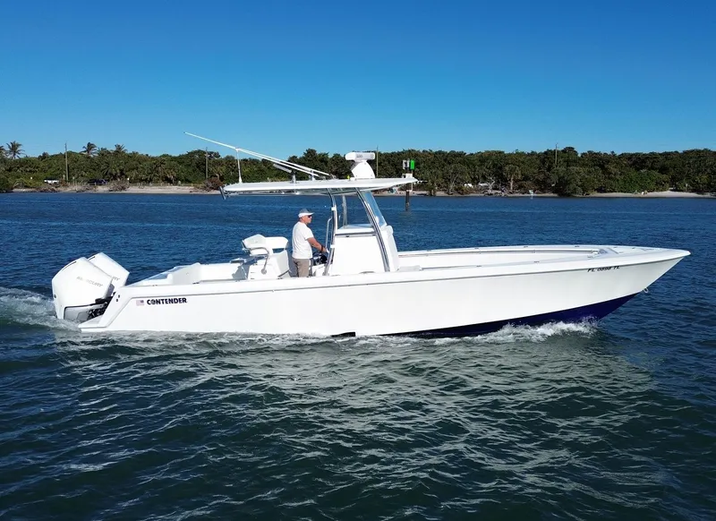The Image of 2023 Contender 32 ST boat cruising on a sunny day. - 0