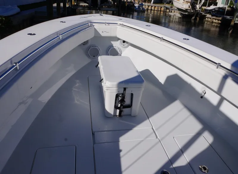 Slide: The Image of 2023 Contender 32 ST boat interior with cooler on deck. - 11