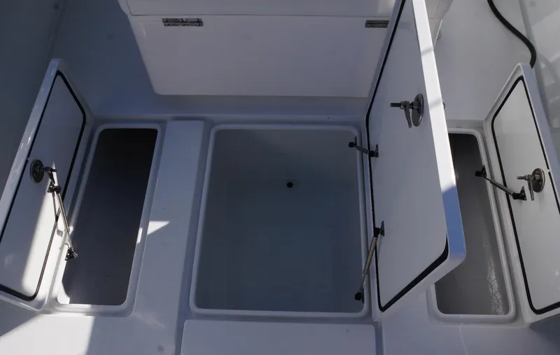 Slide: The Image of 2023 Contender 32 ST boat storage compartments open, showcasing spacious interior design. - 12