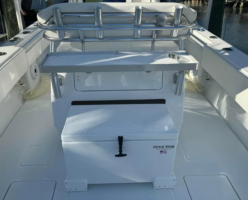 Slide: The Image of 2023 Contender 32 ST boat interior with storage and seating area. - 15