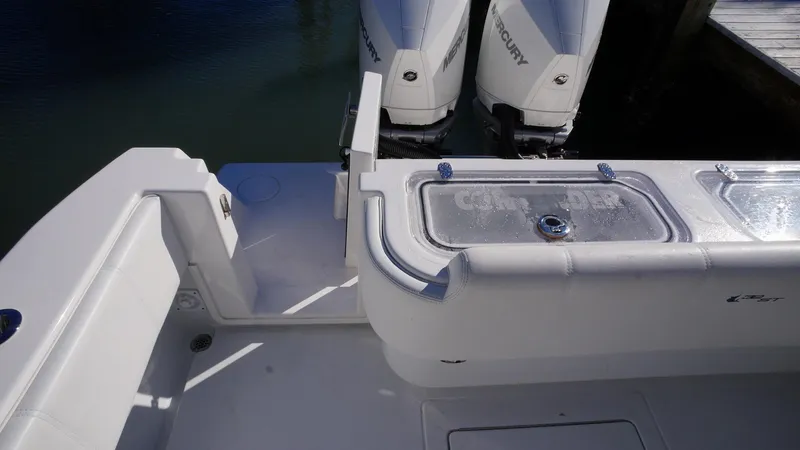 Slide: The Image of 2023 Contender 32 ST boat with dual Mercury engines and sleek deck design. - 16