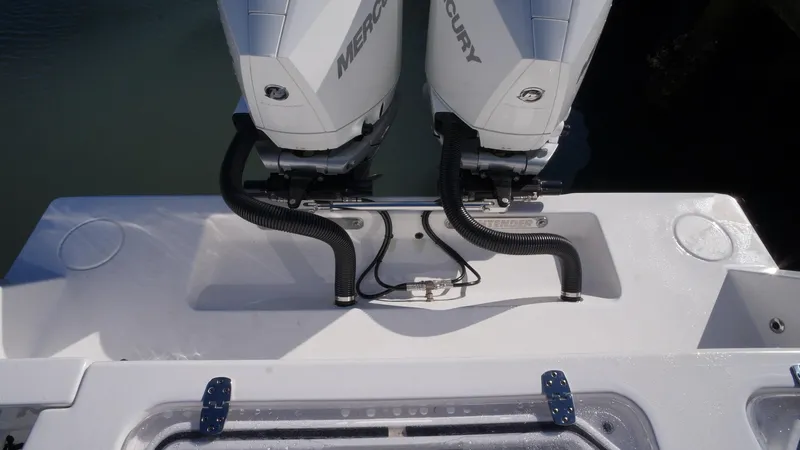 Slide: The Image of 2023 Contender 32 ST boat with dual Mercury outboard engines. - 17