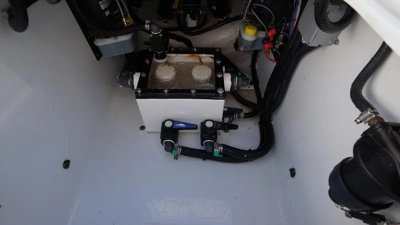 Slide: The Image of 2023 Contender 32 ST boat engine compartment with wiring and components. - 19